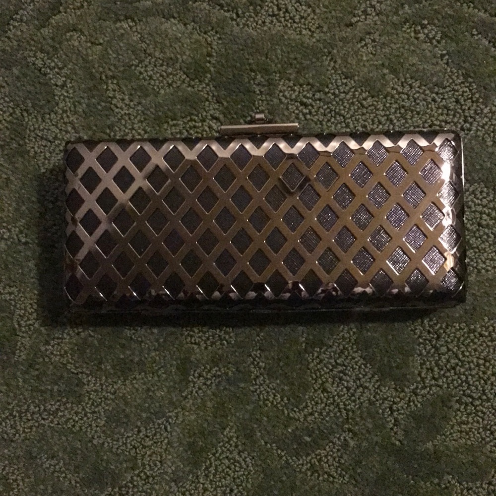 Silver and black clutch. 23” chain strap.